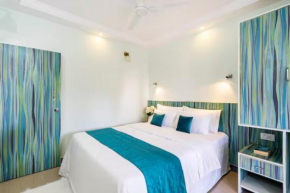 Serene Escape One Bedroom Apartment with AC, Wi-Fi, Gym and 5-Minute Walk to the Beach Cativating Tree and Garden Views